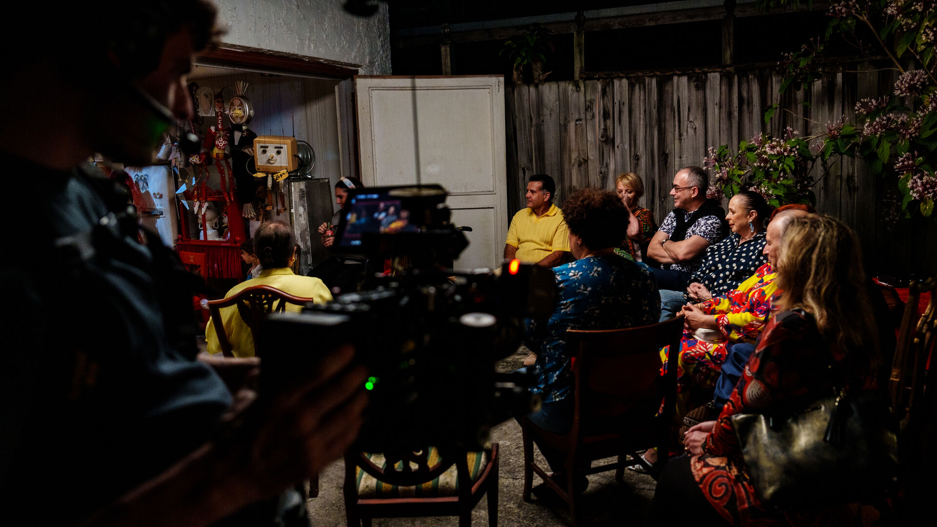 Nighttime community interview being filmed